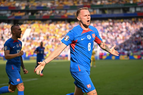 Ondrej Duda celebrates after scoring the opening goal